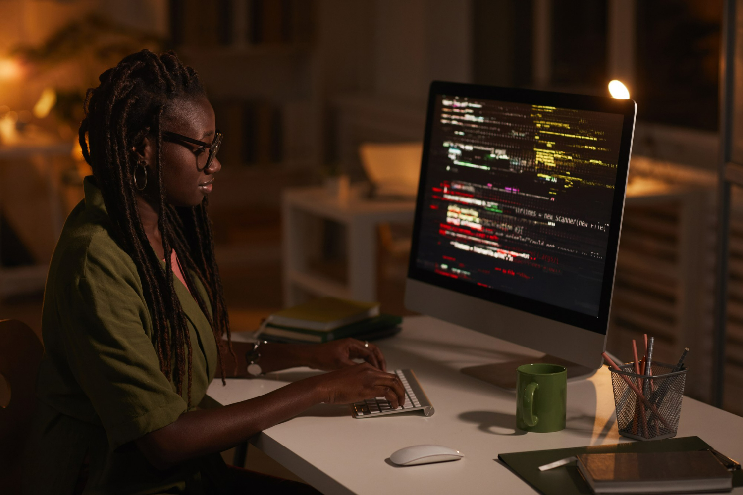 side-view-portrait-contemporary-african-american-woman-writing-code-looking-computer-screen-while-working-dark-office-copy-space